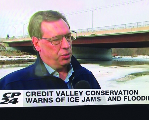 CVC's director of watershed knowledge addressing mediea about ice jams on the Credit River.